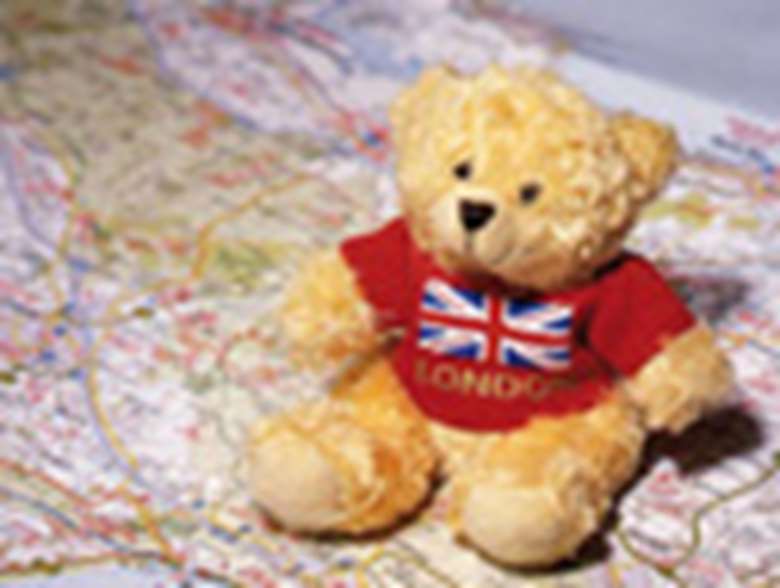 A teddy bear sitting on a map. Credit: Alex Deverill