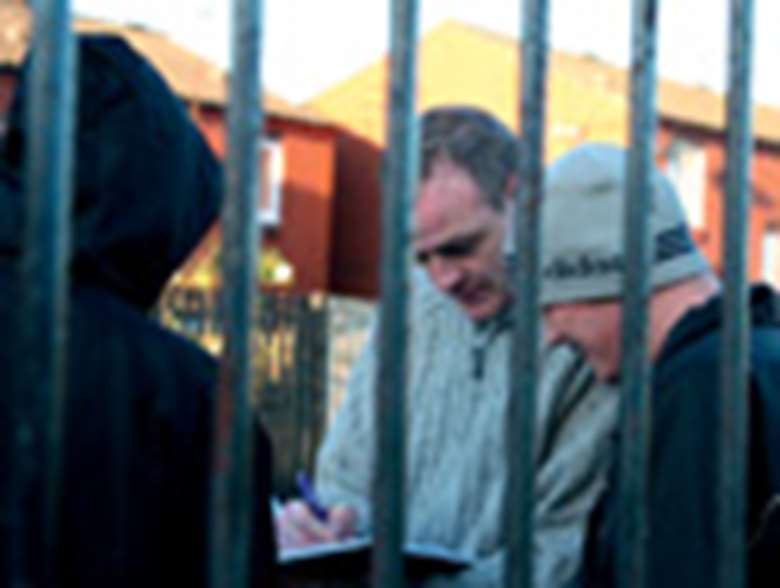 Detached youth worker with young people on street. Credit: Arlen Connelly