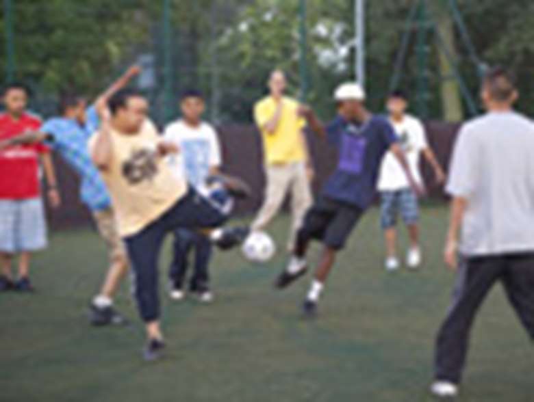 Young people playing football. Credit: Alex Deverill